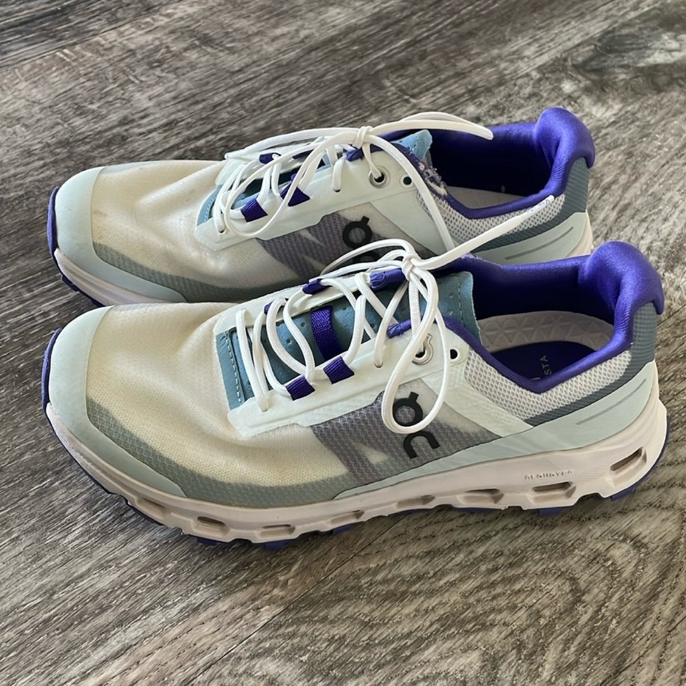 On Running White and Purple Shoes